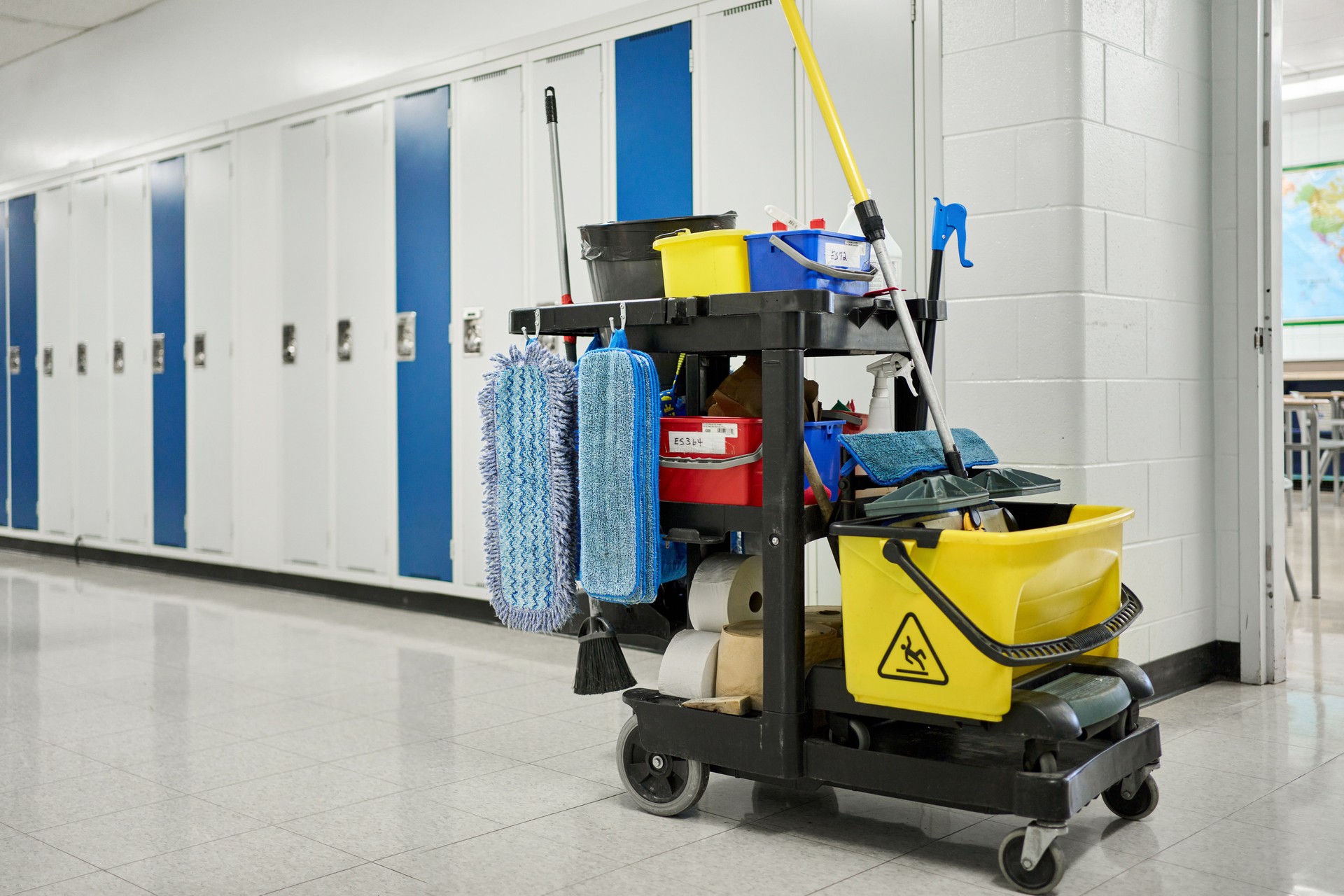 Custodial cart sitting in a school hallway